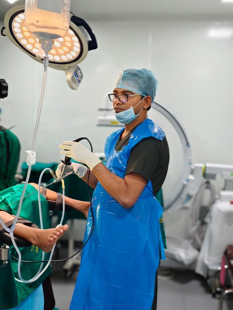 Dr. Santhosh performing surgery